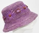 Kangol, Fléchet, hats et caps, model   Rafia straw bucket hat with flowers
